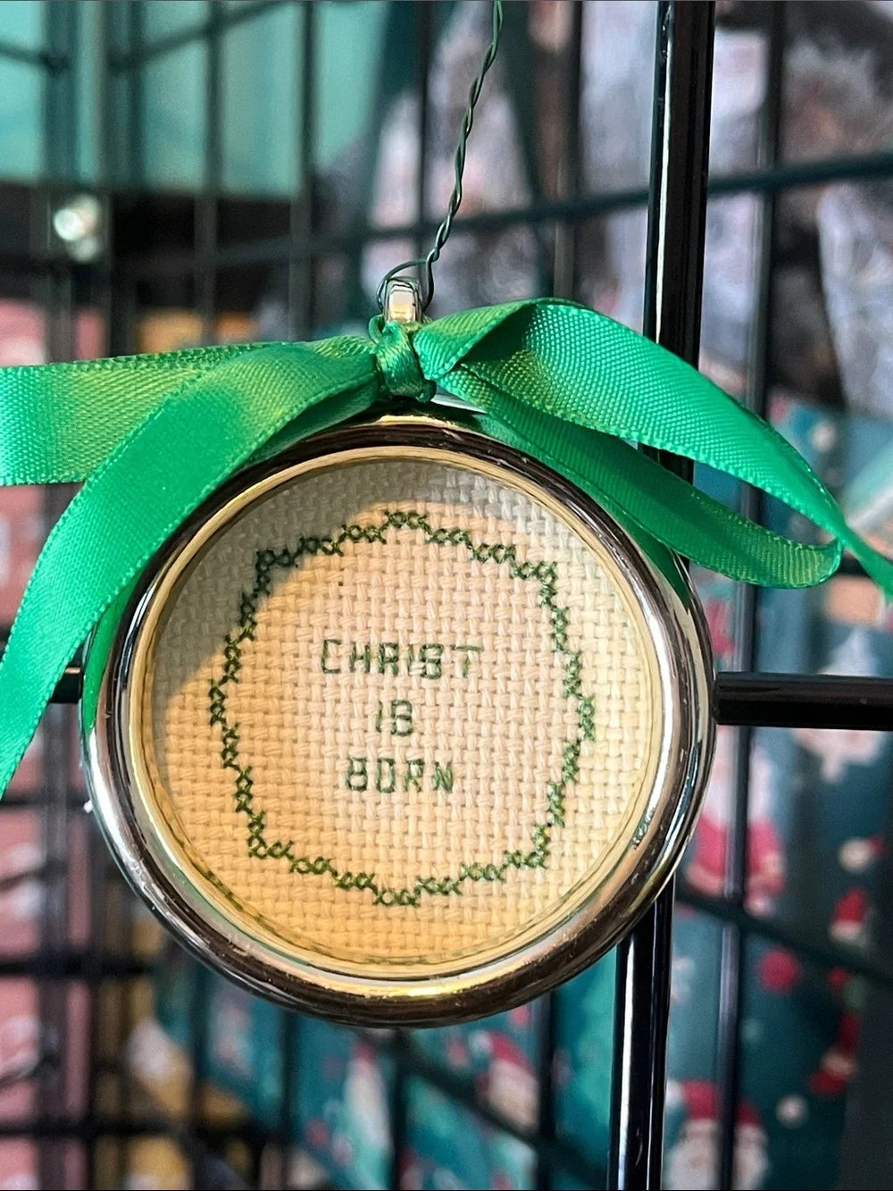 Hand Crafted Christ Is Born Cross-Stitched Holiday Ornament with Green Ribbon